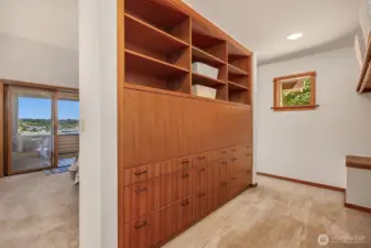 Walk-around closet in Primary Bedroom with beautiful wood built-in drawers