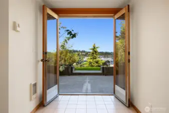 Downstairs exterior entry with french doors that open out to the yard.