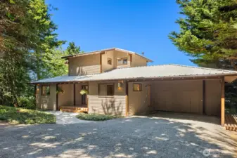 Front entrance to the home with attached carport and storage area.