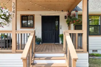 Hellllo curb appeal! With it's fresh wood accents and covered entryway, this is the perfect place to start or end your day.