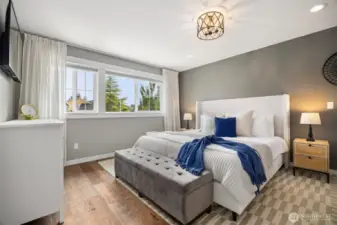The oversized primary bedroom is the perfect escape, with light filtering windows and a spa-inspired ensuite bathroom.