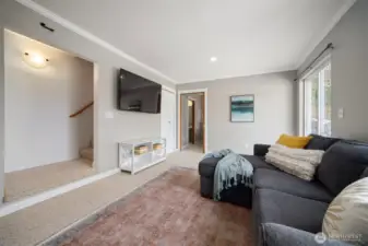 The lower level features a second living room with sliding glass doors out into the fully fenced in back yard, a 4th bedroom and half bath.
