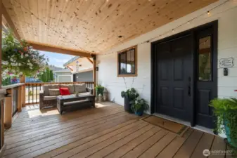 The covered entryway with a large deck is the perfect "Welcome Home".