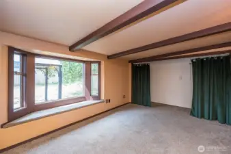 Master suite overlooks backyard with pop out windows and private bath, with tub.
