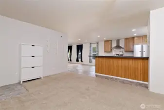View to the kitchen/dining area and a peak at the second living room