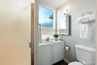 Shower on the second floor serves the primary and guest bedrooms.