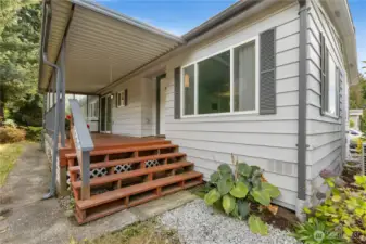 Enter the home to a spacious covered patio