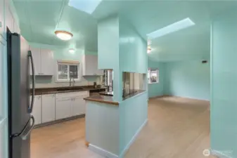 An updated kitchen soaked in natural light from two skylights