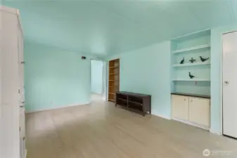 Looking from the kitchen through the living area and into the primary bedroom