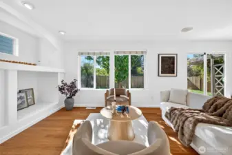 Main living area has abundant light and cozy gas fireplace