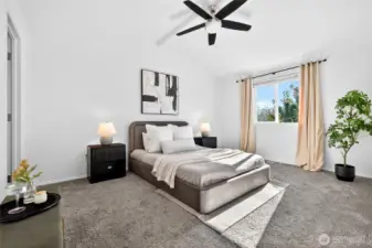 Primary suite has vaulted ceilings