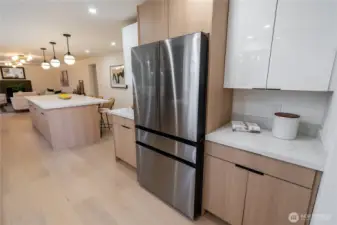 Connected dining, kitchen and family rooms.