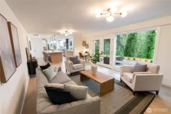 Roomy family room leads to private back yard.