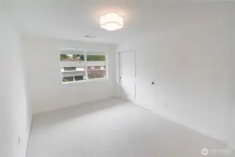 1 of 3 additional spacious bedrooms upstairs.