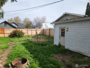 Door which leads from garage to back yard. Fully fenced back yard with access from the alleyway out back.