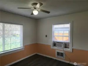 Bedroom 1 large window faces the front of the home