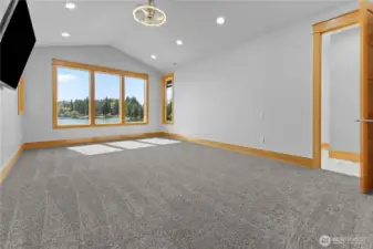 Primary Suite on 2nd floor with double-doors and built-in tv.