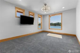 2nd primary suite on 2nd floor with ceiling fan, tv, and WIC