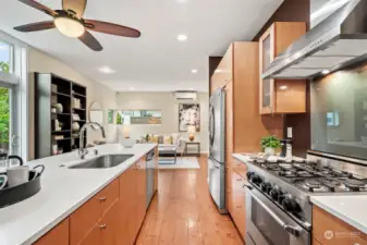 Large central kitchen with premium stainless steel appliances.