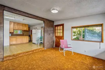 View from living room area towards dining and kitchen.