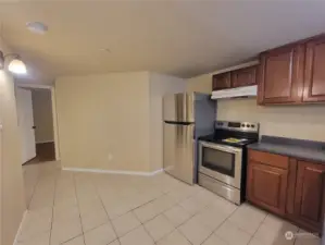 Lower unit/ADU kitchen. Door to left is access to 2nd bedroom