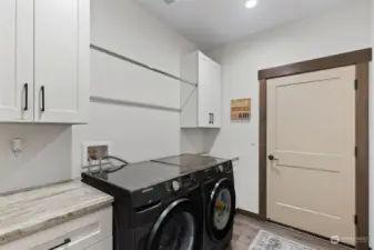 Laundry room with appliances included leading to garage.