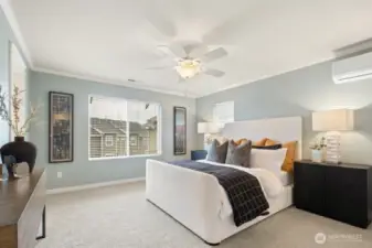 Relaxing primary retreat with ceiling fan