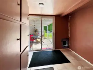 mud room with dog door