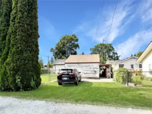 Ally parking behind detached garage