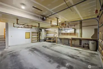 Two car garage with work space. Freshly painted stairs to living space.