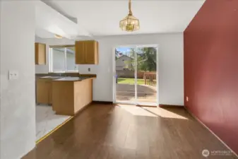 Spacious dining room with slider leading to the enormous back yard.