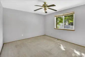 The primary bedroom can comfortably hold a king size bed along with furniture.  It is very spacious.
