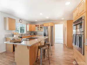 Eating bar with downdraft cooktop