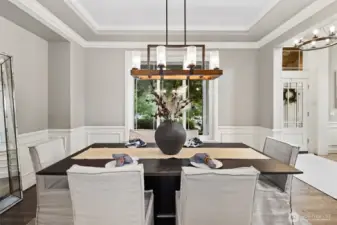 The dining room exudes timeless charm, with ample space for gatherings and a warm, inviting atmosphere that makes every meal feel special.