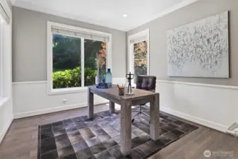 The main-floor office offers a quiet, versatile space with ample natural light—perfect for remote work, study, or creative projects.