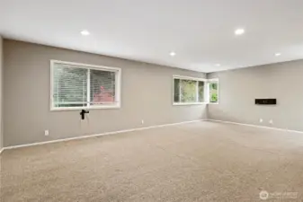 The large upstairs bonus room provides a versatile space flooded with natural light. It's perfect for a media room, play area, or extra living space to suit your needs.