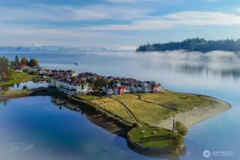 The beautiful Inn at Port Ludlow is surrounded by the marina, public beaches, community activities, and stunning views of Port Ludlow Bay and Admiralty Inlet and Mount Baker in the background.