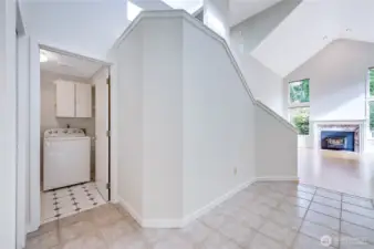 From the front entry, the utility room to the right offers cabinet storage, a cubby, and access to the oversized two-car garage, while a hallway closet sits conveniently to the left.