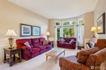 Spacious living room with large windows provide a nice view of your front yard.