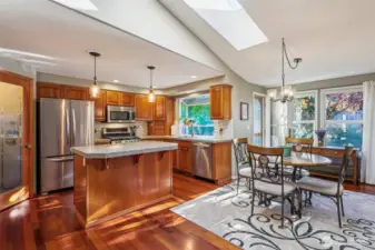 Enjoy an updated kitchen with drop lighting, herb window, walk-in pantry, gas range and granite counters.