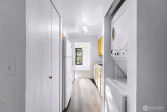 The kitchen cabinets are freshly painted and the washer and dryer stay with the unit.