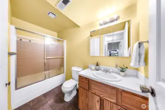 There is plenty of storage in the bathroom beneath the sink as well as a large closet to the left.