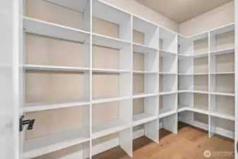 Who wouldn't want this dreamy walk-in pantry, quietly hidden behind the wine & coffee station?