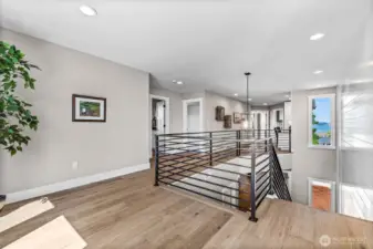 Open "room" at the top of the stairs, perfect for game table, chaise & bookshelf or additional desk area. Built in desk is down the hall a bit.