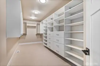 Walk in closet in Primary with custom built ins to make any discerning new homeowner happy!