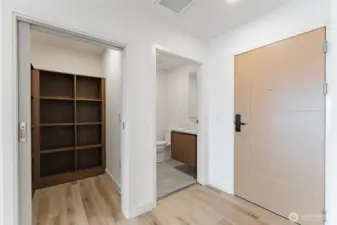 Entry half bath and pantry.