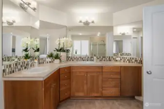 Beautiful spa bath with gorgeous cabinets and double vanity.