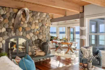 The river rock fireplace anchors the main living in a cozy and comforting way.