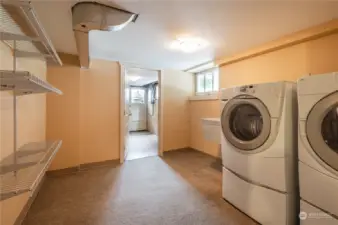 Laundry area and large attached utility room with outdoor access. MIL?