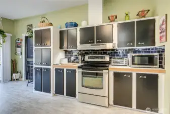Tucked between the sliding door and the cabinetry is the utility room.